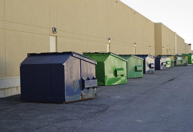 roll-off dumpsters ready for delivery to a construction project in Ellisville, MS